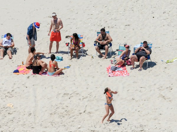 NJ Gov. Chris Christie (right) and his family enjoy a picture perfect Sunday afternoon at the beach on Island Beach State Park, which is closed to the public due to the state government shutdown.  7/2/17  (Andrew Mills | NJ Advance Media for NJ.com)