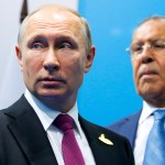 Russian President Vladimir Putin, left, and Foreign Minister Sergey Lavrov stand while waiting for Turkish President Recep Tayyip Erdogan prior to their talks at the G-20 summit in Hamburg, northern Germany, Saturday, July 8, 2017.  (AP Photo/Alexander Zemlianichenko, Pool)