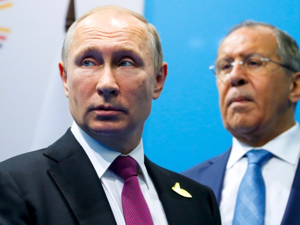 Russian President Vladimir Putin, left, and Foreign Minister Sergey Lavrov stand while waiting for Turkish President Recep Tayyip Erdogan prior to their talks at the G-20 summit in Hamburg, northern Germany, Saturday, July 8, 2017.  (AP Photo/Alexander Zemlianichenko, Pool)