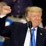 President Donald Trump pumps his fist and smiles as he speaks at the Covelli Centre, Tuesday, July 25, 2017, in Youngstown, Ohio. (AP Photo/Tony Dejak)
