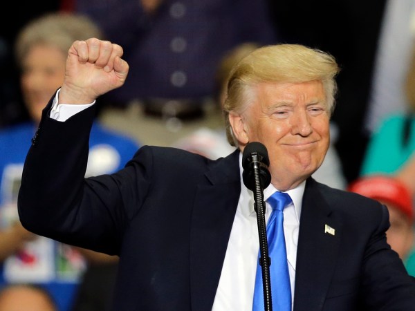 President Donald Trump pumps his fist and smiles as he speaks at the Covelli Centre, Tuesday, July 25, 2017, in Youngstown, Ohio. (AP Photo/Tony Dejak)