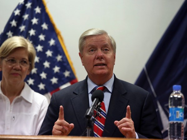 U.S. Senator Lindsey Graham right, speaks during a press conference at Resolute Support headquarters in Kabul, Afghanistan, Tuesday, July 4, 2017, (AP Photo/Rahmat Gul)