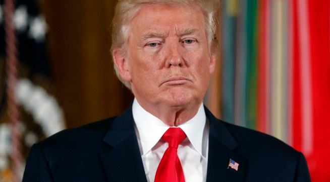 President Donald Trump stands as he waits to bestow the nation's highest military honor, the Medal of Honor to retired Army medic James McCloughan during a ceremony in the East Room of the White House in Washington, Monday, July 31, 2017. McCloughan is credited with saving the lives of members of his platoon nearly 50 years ago in the Battle of Nui Yon Hill in Vietnam. (AP Photo/Pablo Martinez Monsivais)