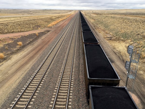 A train near hauls coal mined from Wyoming's Powder River Basin near Bill, Wyo., Tuesday, March 28, 2017. President Donald Trump's lifting of a federal coal leasing moratorium issued last year by President Barack Obama will allow new leasing of federal coal to resume in the basin and elsewhere. (AP photo/Mead Gruver)