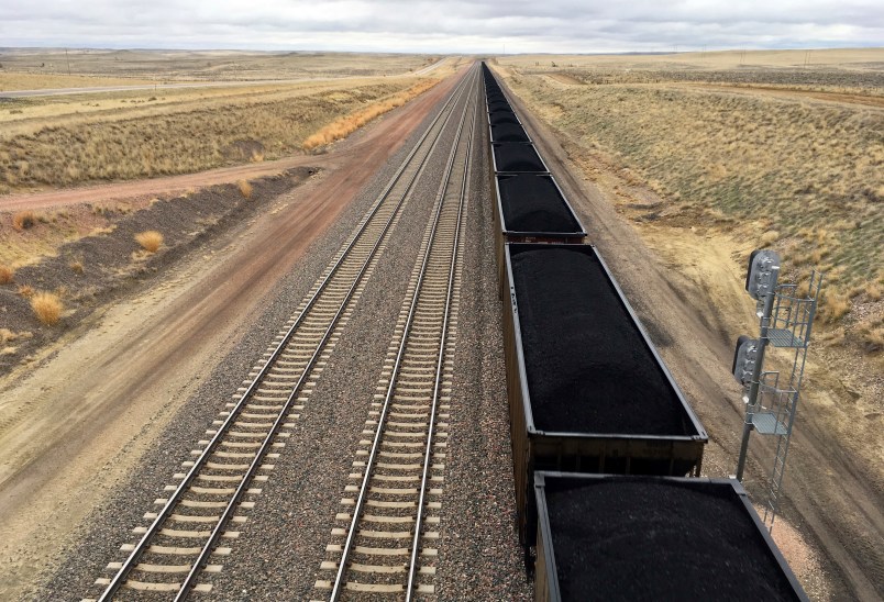 A train near hauls coal mined from Wyoming's Powder River Basin near Bill, Wyo., Tuesday, March 28, 2017. President Donald Trump's lifting of a federal coal leasing moratorium issued last year by President Barack Obama will allow new leasing of federal coal to resume in the basin and elsewhere. (AP photo/Mead Gruver)