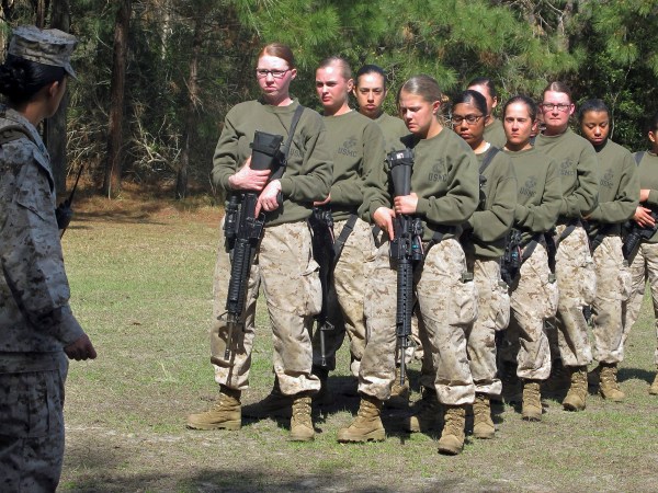HOLD FOR STORY MOVING EARLY RISER JUNE 9 BY JENNIFER MCDERMOTT    ----    FILE - In this Feb. 21, 2013 file photo, female recruits stand at the Marine Corps Training Depot on Parris Island, S.C.  U.S. Secretary of the Navy Ray Mabus said in an interview on June 3, 2016, that the Navy and Marine Corps will be dropping “man” from some of their job titles to make them inclusive and gender-neutral. (AP Photo/Bruce Smith, File)
