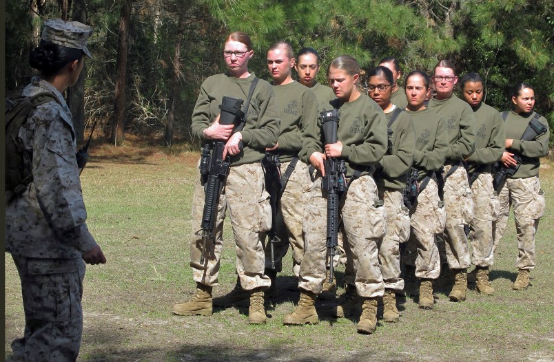 HOLD FOR STORY MOVING EARLY RISER JUNE 9 BY JENNIFER MCDERMOTT    ----    FILE - In this Feb. 21, 2013 file photo, female recruits stand at the Marine Corps Training Depot on Parris Island, S.C.  U.S. Secretary of the Navy Ray Mabus said in an interview on June 3, 2016, that the Navy and Marine Corps will be dropping “man” from some of their job titles to make them inclusive and gender-neutral. (AP Photo/Bruce Smith, File)