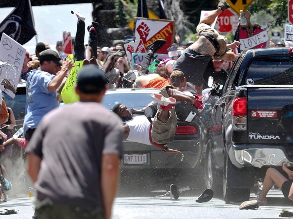 A vehicle plows into a group of protesters marching along 4th Street NE at the Downtown Mall in Charlottesville on the day of the Unite the Right rally on Saturday, August 12, 2017. Photo/Ryan M. Kelly/The Daily Progress