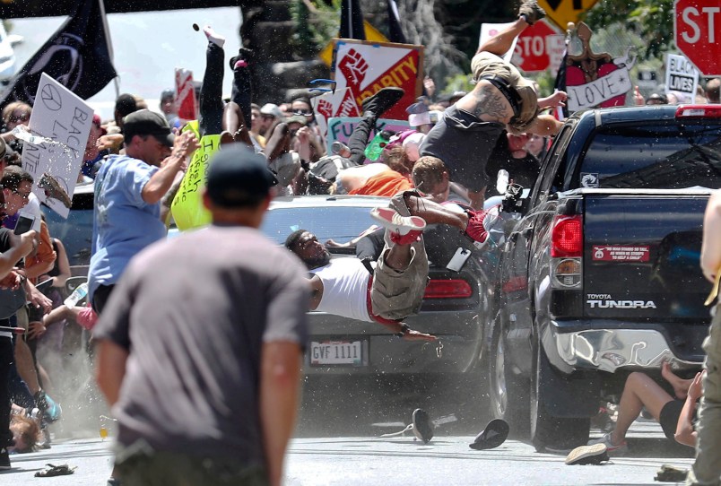 A vehicle plows into a group of protesters marching along 4th Street NE at the Downtown Mall in Charlottesville on the day of the Unite the Right rally on Saturday, August 12, 2017. Photo/Ryan M. Kelly/The Daily Progress