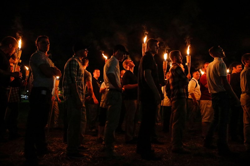 Multiple white nationalist groups march with torches through the UVA campus in Charlottesville on Friday, August 11, 2017. When met by counter protesters, some yelling "Black lives matter," tempers turned into violence. Multiple punches were thrown, pepper spray was sprayed and torches were used as weapons. Mandatory Credit: Mykal McEldowney/IndyStar via USA TODAY NETWORK