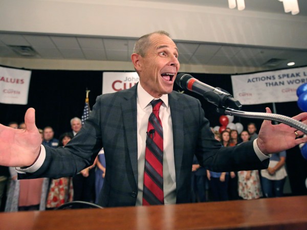 Provo Mayor John Curtis celebrates after winning Utah's Republican primary to become the overwhelming favorite to fill the U.S. House seat vacated by Jason Chaffetz  Tuesday, Aug. 15, 2017, in Provo, Utah. Curtis of Provo, defeated former state lawmaker Chris Herrod and business consultant Tanner Ainge, son of Boston Celtics president Danny Ainge. (AP Photo/Rick Bowmer)