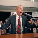 Provo Mayor John Curtis celebrates after winning Utah's Republican primary to become the overwhelming favorite to fill the U.S. House seat vacated by Jason Chaffetz  Tuesday, Aug. 15, 2017, in Provo, Utah. Curtis of Provo, defeated former state lawmaker Chris Herrod and business consultant Tanner Ainge, son of Boston Celtics president Danny Ainge. (AP Photo/Rick Bowmer)