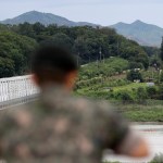 A South Korean soldier watch the north side at the Imjingak Pavilion in Paju, South Korea, Wednesday, Aug. 16, 2017. China has urged the United States and North Korea to "hit the brakes" on threatening words and work toward a peaceful resolution of their tense standoff created by Pyongyang's recent missile tests and threats to fire them toward Guam. The dispute has also raised fears in South Korea, where a conservative political party on Wednesday called for the United States to bring back tactical nuclear weapons to the Korean Peninsula. (AP Photo/Lee Jin-man)