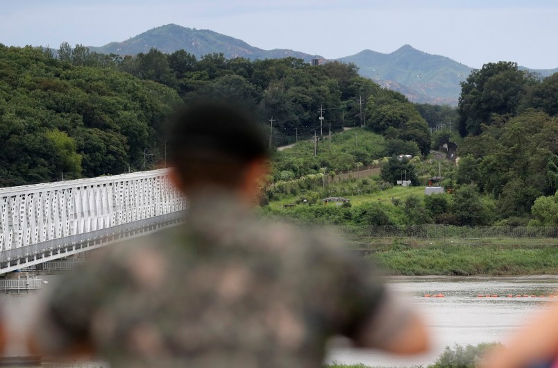 A South Korean soldier watch the north side at the Imjingak Pavilion in Paju, South Korea, Wednesday, Aug. 16, 2017. China has urged the United States and North Korea to "hit the brakes" on threatening words and work toward a peaceful resolution of their tense standoff created by Pyongyang's recent missile tests and threats to fire them toward Guam. The dispute has also raised fears in South Korea, where a conservative political party on Wednesday called for the United States to bring back tactical nuclear weapons to the Korean Peninsula. (AP Photo/Lee Jin-man)