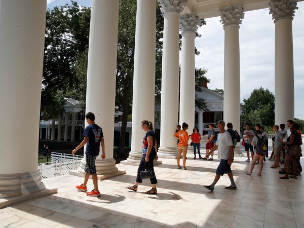First year students tour the Rotunda of the University of Virginia, Friday, Aug. 18, 2017, in Charlottesville, Va., a week after a white nationalist rally took place on campus. (AP Photo/Jacquelyn Martin)