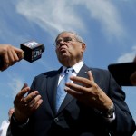 U.S. Sen. Bob Menendez, center, takes questions after news conference talking about flood insurance, Thursday, Aug. 17, 2017, in Union Beach, N.J. Menendez and Rep. Frank Pallone, far right, want changes made to federal flood insurance they said will fix a system that often failed beleaguered homeowners, including in the aftermath of Superstorm Sandy. The two Democrats described legislation they have proposed that will reauthorize a 2012 flood insurance bill scheduled to expire next month and add key provisions. After the press conference, Menenedez fielded questions about his upcoming trial in which he is facing federal corruption charges. (AP Photo/Julio Cortez)