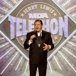 FILE - In this Sept. 2, 1990 file photo, entertainer Jerry Lewis makes his opening remarks at the 25th Anniversary of the Jerry Lewis MDA Labor Day Telethon fundraiser in Los Angeles. MDA said Friday, May 1, 2015, that the Labor Day television fundraising tradition for decades, is ending. Celebrities including Frank Sinatra, John Lennon and Michael Jackson to Pitbull and Jennifer Lopez have performed on the telethon, first hosted by Lewis and Dean Martin in 1956. It moved to Labor Day in 1966. (AP Photo/Julie Markes, File)