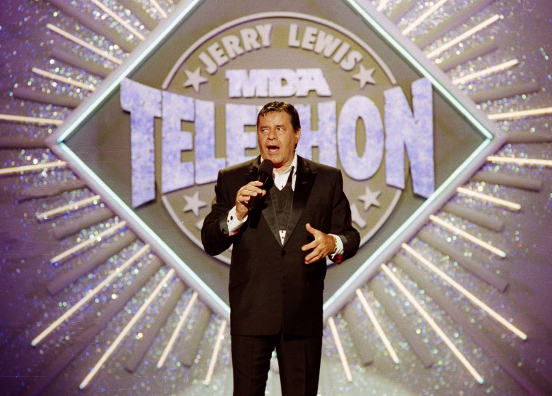 FILE - In this Sept. 2, 1990 file photo, entertainer Jerry Lewis makes his opening remarks at the 25th Anniversary of the Jerry Lewis MDA Labor Day Telethon fundraiser in Los Angeles. MDA said Friday, May 1, 2015, that the Labor Day television fundraising tradition for decades, is ending. Celebrities including Frank Sinatra, John Lennon and Michael Jackson to Pitbull and Jennifer Lopez have performed on the telethon, first hosted by Lewis and Dean Martin in 1956. It moved to Labor Day in 1966. (AP Photo/Julie Markes, File)