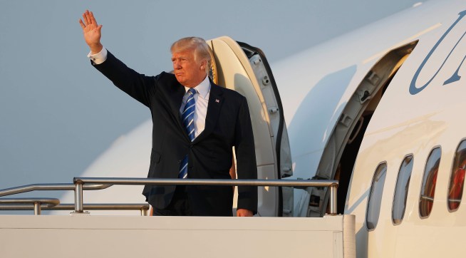 President Donald Trump first lady Melania Trump and son Barron Trump board Air Force One at Morristown Municipal Airport, Sunday, Aug. 20, 2017 in Morristown, N.J., for the return flight to Washington. (AP Photo/Pablo Martinez Monsivais)
