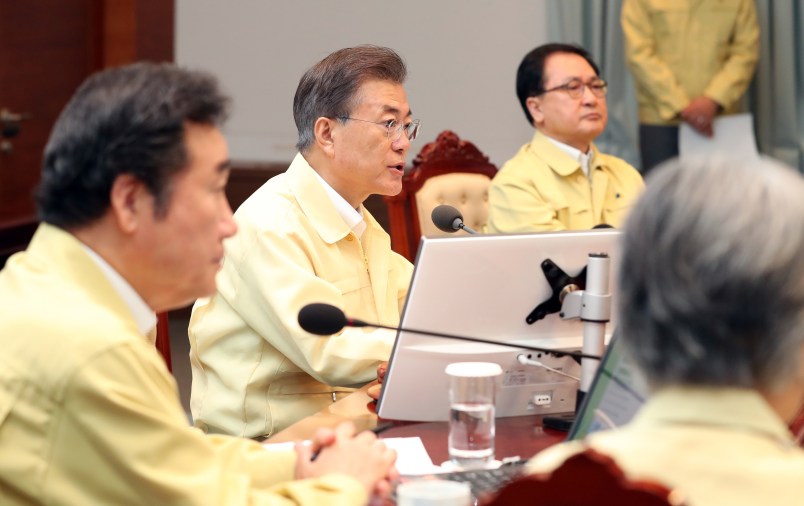 South Korean President Moon Jae-in, center, presides over a cabinet meeting at the presidential Blue House in Seoul, South Korea, Monday, Aug. 21, 2017. U.S. and South Korean troops have begun annual drills that come after tensions rose over North Korea's two intercontinental ballistic missile tests last month. South Korea's President Moon Jae-in said Monday the drills are defensive in nature. He says the drills are held regularly because of repeated provocations by North Korea. (Kim Ju-hyung/Yonhap via AP)