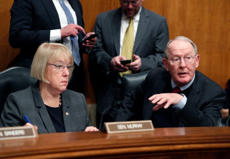Senate Health, Education, Labor, and Pensions Committee Chairman Sen. Lamar Alexander, R-Tenn., accompanied by the committee's ranking member Sen. Patty Murray, D-Wash. speaks on Capitol Hill in Washington, Tuesday, Jan. 31, 2107, during the committee's executive session to discuss the nomination of Education Secretary-designate Betsy DeVos.  (AP Photo/Alex Brandon)