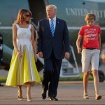 President Donald Trump, first lady Melania Trump and son Barron Trump walk across the tarmac before boarding Air Force One at Morristown Municipal Airport, Sunday, Aug. 20, 2017, in Morristown, N.J., for the return flight to the Washington area. (AP Photo/Pablo Martinez Monsivais)