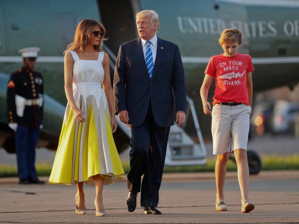 President Donald Trump, first lady Melania Trump and son Barron Trump walk across the tarmac before boarding Air Force One at Morristown Municipal Airport, Sunday, Aug. 20, 2017, in Morristown, N.J., for the return flight to the Washington area. (AP Photo/Pablo Martinez Monsivais)