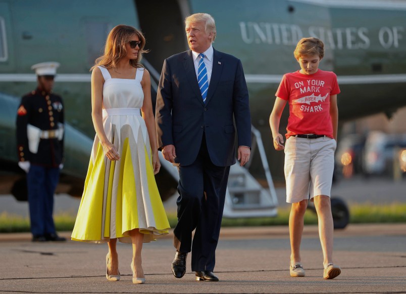 President Donald Trump, first lady Melania Trump and son Barron Trump walk across the tarmac before boarding Air Force One at Morristown Municipal Airport, Sunday, Aug. 20, 2017, in Morristown, N.J., for the return flight to the Washington area. (AP Photo/Pablo Martinez Monsivais)