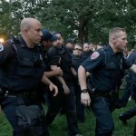 Police arrest a man during a protest at a Confederate monument at the University of North Carolina in Chapel Hill, N.C., Tuesday, Aug. 22, 2017. (AP Photo/Gerry Broome)
