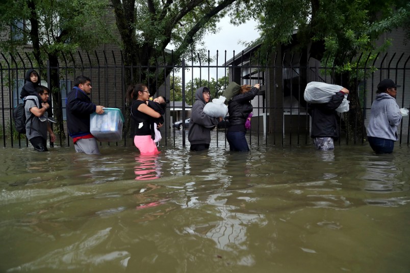 Residents from Bayou Parc at Oak Forest carry their belongings while evacuating the apartment complex during the Tropical Storm Harvey, Sunday, Aug. 27, 2017, in Houston. ( Marie D. De Jesus / Houston Chronicle )