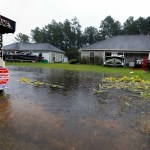 Rising waters threaten these homes along North Perkins Ferry Road in Moss Bluff, La., near Lake Charles, La., as a constant rain from Tropical Storm Harvey falls, Monday, Aug. 28, 2017. (AP Photo/Rogelio V. Solis)