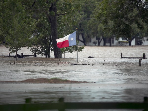 A Texas flag flies in flood waters caused by Hurricane Harvey. La Grange, TX. in Fayette County endured historic flooding when the Colorado River crested over flood stage at more than 53 feet Monday August 28, 2017. City streets and businesses were completely under water and some neighborhoods remain uninhabitable for the foreseeable future.RALPH BARRERA / AMERICAN-STATESMAN