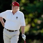 FILE - In this June 27, 2012, file photo, Donald Trump stands on the 14th fairway during a pro-am round of the AT&T National golf tournament at Congressional Country Club in Bethesda, Md. A set of golf clubs that Donald Trump gifted to a former caddie before becoming president is being auctioned off. Boston-based RR Auction says Trump used the TaylorMade RAC TP ForgedIrons clubs at the Trump National Golf Club in Bedminster, New Jersey. (AP Photo/Patrick Semansky, File)