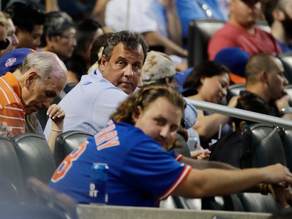 New Jersey Gov. Chris Christie watches during the fourth inning of a baseball game between the New York Mets and the St. Louis Cardinals at Citi Field Tuesday, July 18, 2017, in New York. (AP Photo/Frank Franklin II)