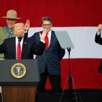 President Trump, front left, gestures as former boys scouts, Ryan Zinke, left, Secretary of Interior, Rick Perry, Secretary of Energy,  center, and Tom Price Secretary of Health and Human Services, right,  at the 2017 National Boy Scout Jamboree at the Summit in Glen Jean,W. Va., Monday, July 24, 2017.  (AP Photo/Steve Helber)
