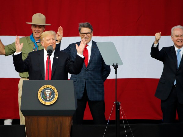 President Trump, front left, gestures as former boys scouts, Ryan Zinke, left, Secretary of Interior, Rick Perry, Secretary of Energy,  center, and Tom Price Secretary of Health and Human Services, right,  at the 2017 National Boy Scout Jamboree at the Summit in Glen Jean,W. Va., Monday, July 24, 2017.  (AP Photo/Steve Helber)