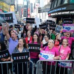 Protestors gather in Times Square Wednesday, July 26, 2017, in New York. (AP Photo/Frank Franklin II)