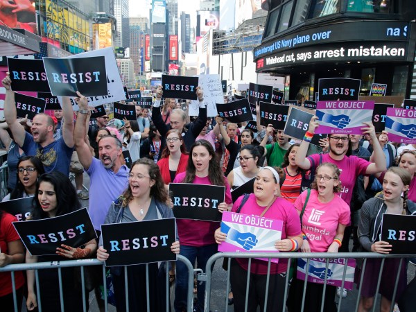 Protestors gather in Times Square Wednesday, July 26, 2017, in New York. (AP Photo/Frank Franklin II)