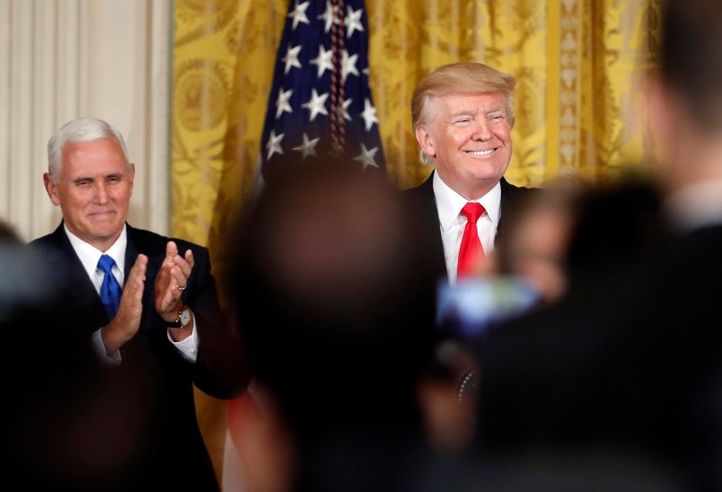 President Donald Trump, accompanied by Vice President Mike Pence, smiles before speaking in the East Room of the White House, Wednesday, July 26, 2017, in Washington. Trump is announcing the first U.S. assembly plant for electronics giant Foxconn in a project that's expected to result in billions of dollars in investment in the state and create thousands of jobs. (AP Photo/Alex Brandon)