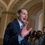 Sen. Ron Wyden, D-Ore., the ranking member of the Senate Finance Committee, with Sen. Debbie Stabenow, D-Mich., rear, talks about tax reform during a news conference on Capitol Hill in Washington, Tuesday, Aug. 1, 2017.   (AP Photo/J. Scott Applewhite)