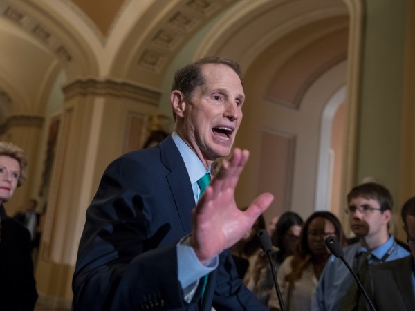 Sen. Ron Wyden, D-Ore., the ranking member of the Senate Finance Committee, with Sen. Debbie Stabenow, D-Mich., rear, talks about tax reform during a news conference on Capitol Hill in Washington, Tuesday, Aug. 1, 2017.   (AP Photo/J. Scott Applewhite)