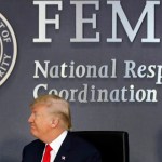 President Donald Trump turns to Vice President Mike Pence as they meet with emergency officials to discuss the hurricane season, Friday, Aug. 4, 2017, at Federal Emergency Management Agency (FEMA) headquarters in Washington. (AP Photo/Jacquelyn Martin)