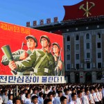 Tens of thousands of North Koreans gathered for a rally at Kim Il Sung Square carrying placards and propaganda slogans as a show of support for their rejection of the United Nations' latest round of sanctions on Wednesday Aug. 9, 2017, in Pyongyang, North Korea. (AP Photo/Jon Chol Jin)