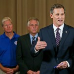 Charlottesville mayor, Mike Signer, right, gestures during a news conference as Virginia Gov. Terry McAuliffe, center, and Virginia Secretary of Public safety, Brian Moran,left, as  they address the the Alt Right rally and violence in Charlottesville, Va., Saturday, Aug. 12, 2017.  (AP Photo/Steve Helber)