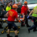 A person is taken away by the EMS workers after a car ran into pedestrians during a Unite the Right rally protest over the name change of Lee Park on Saturday Aug. 12, 2017 in Charlottesville