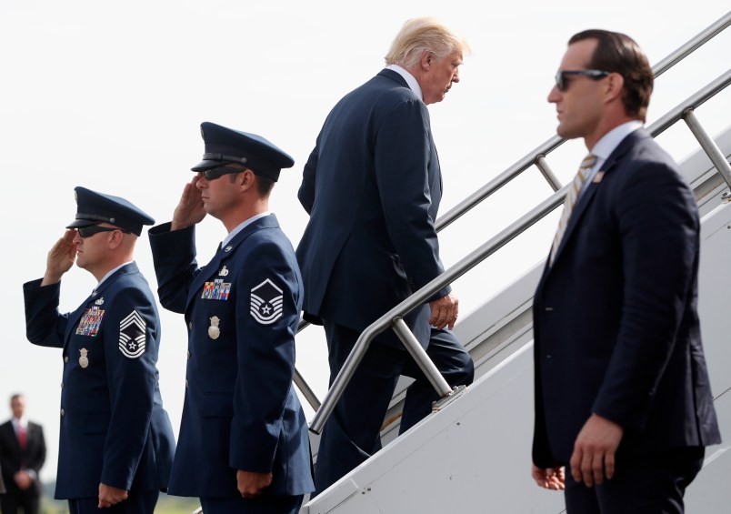 President Donald Trump Boards Air Force One at Morristown Municipal Airport, Monday, Aug. 14, 2017 in Morristown, N.J. Trump is traveling back to White House to sign an executive order at the White House and then later today travels to New York City and will stay through Wednesday. (AP Photo/Pablo Martinez Monsivais)
