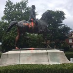 A statue of a Confederate officer is seen splattered with orange paint near a park in Louisville, Ky. on Monday, Aug. 14, 2017. The vandalism was discovered a day after violence erupted at a white nationalist rally in Charlottesville, Va. (AP Photo/Claire Galofaro)