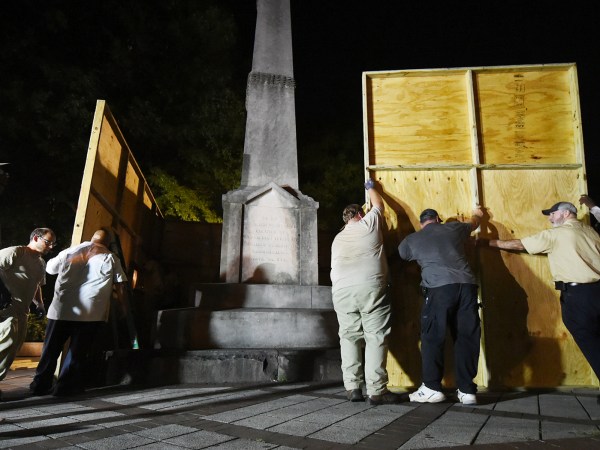 Birmingham city workers covered the Confederate Monument in Linn Park Tuesday night on orders from Mayor William Bell. It took the workers about 45 minutes to erect the 12x16 foot plywood enclosure around the base of the monument. (Joe Songer | jsonger@al.com).