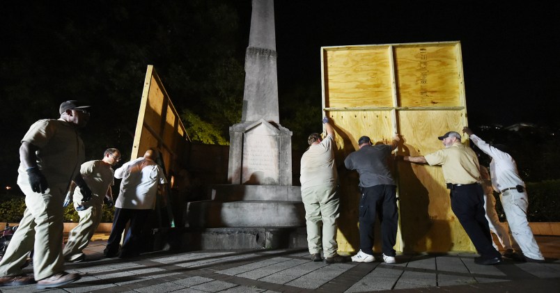 Birmingham city workers covered the Confederate Monument in Linn Park Tuesday night on orders from Mayor William Bell. It took the workers about 45 minutes to erect the 12x16 foot plywood enclosure around the base of the monument. (Joe Songer | jsonger@al.com).