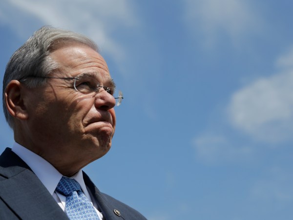 U.S. Sen. Bob Menendez fields questions about his upcoming trial in which he is facing federal corruption charges after completing a flood insurance news conference, Thursday, Aug. 17, 2017, in Union Beach, N.J. (AP Photo/Julio Cortez)